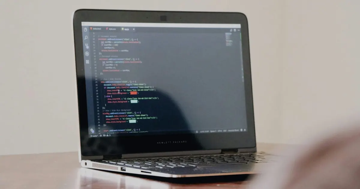 Laptop displaying programming code